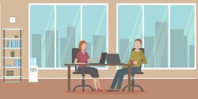 Zwei Menschen an einem Arbeitsplatz in einem hellen, freundlichen Büroraum.