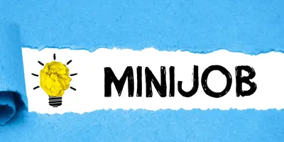 Ein Schriftzug mit dem Wort "Minijob", umrahmt von blauem Papier. Links neben der Schrift ist eine Glühbirne zu sehen.